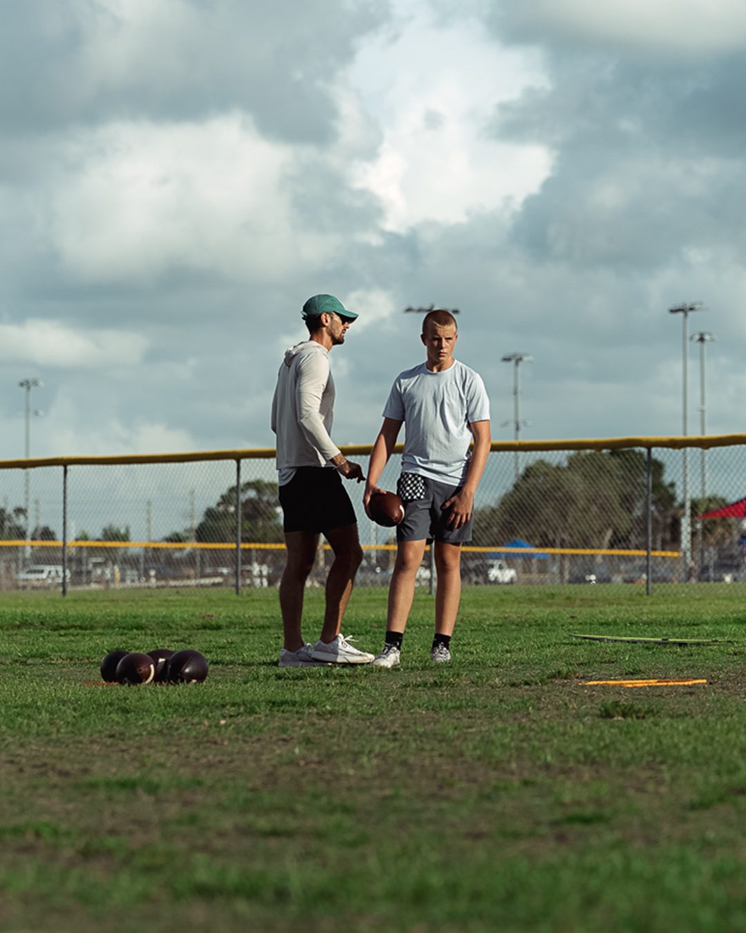 Sage Hansard coaching a quarterback